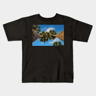 Two palms against blue cloudy sky Kids T-Shirt